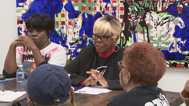 Family members talk at a Mothers in Charge support gathering 