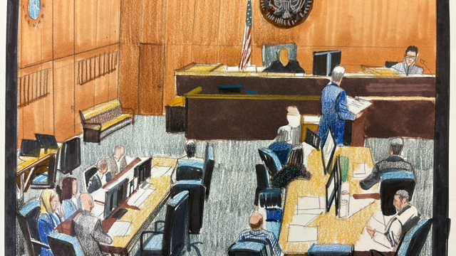 peter-on-stand-wide-with-his-attorney.png 