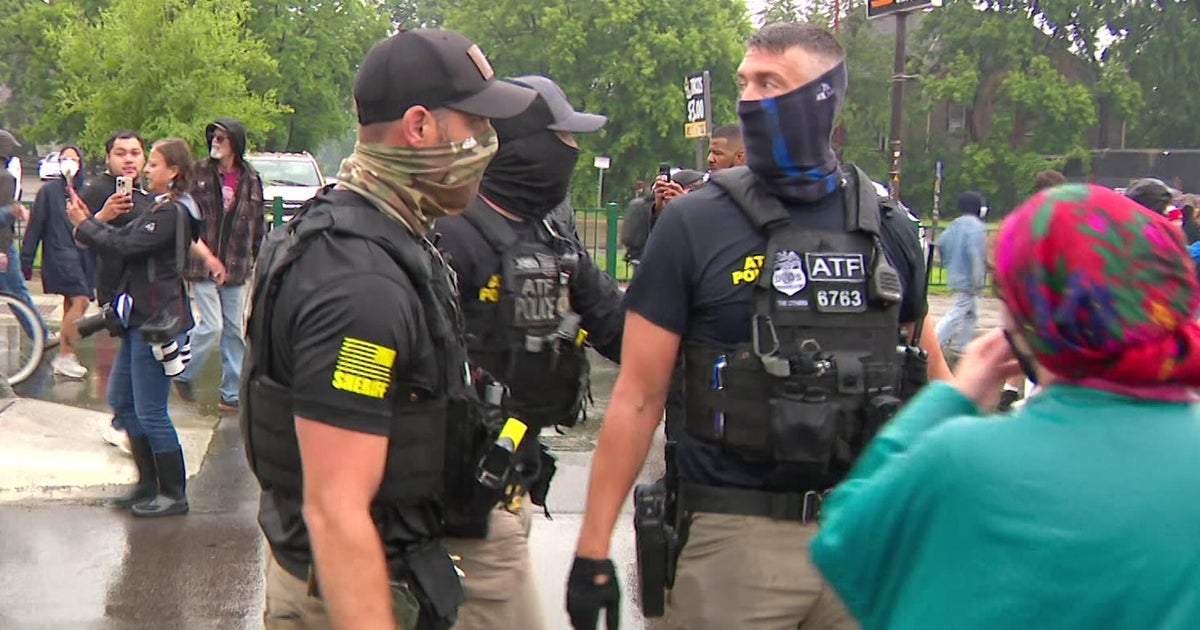 Why did federal agents wear masks during the south Minneapolis raid? 