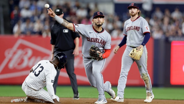 Gabriel Arias #13 of the Cleveland Guardians turns a double play over Jazz Chisholm Jr. #13 of the New York Yankees to end the seventh inning at Yankee Stadium on June 04, 2025 in New York City. 